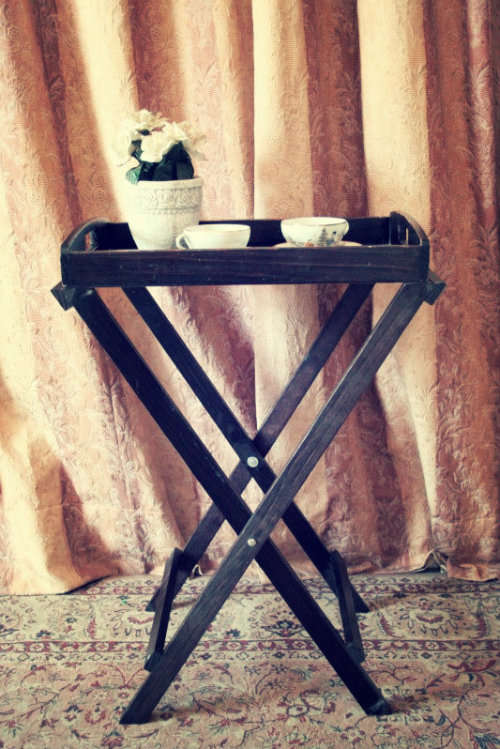 A lovely wooden butlers tray w/ removable tray, perfect for extra serving space around the house.