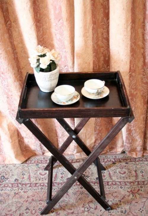 A lovely wooden butlers tray w/ removable tray, perfect for extra serving space around the house.