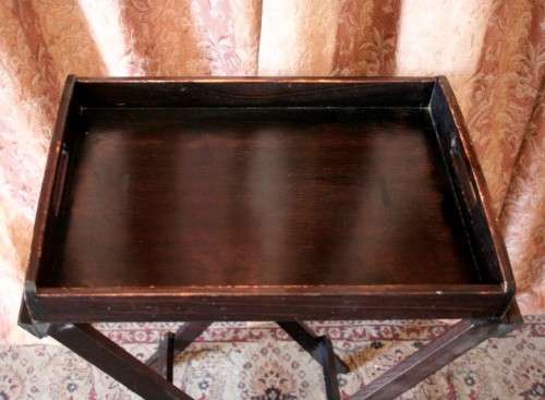 A lovely wooden butlers tray w/ removable tray, perfect for extra serving space around the house.