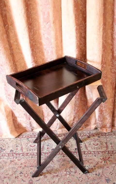 A lovely wooden butlers tray w/ removable tray, perfect for extra serving space around the house.