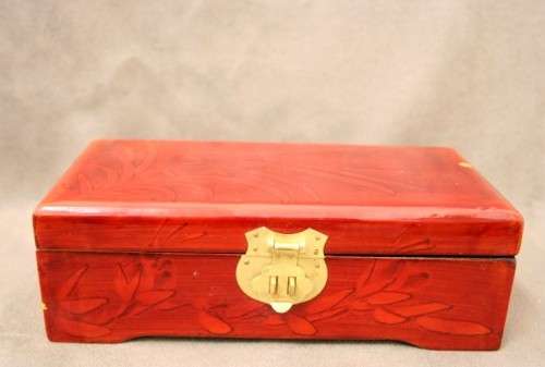 A beautifully made wooden Chinese jewellery box with brass latch and hinges.