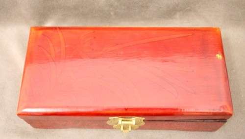 A beautifully made wooden Chinese jewellery box with brass latch and hinges.