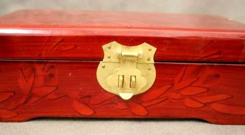 A beautifully made wooden Chinese jewellery box with brass latch and hinges.