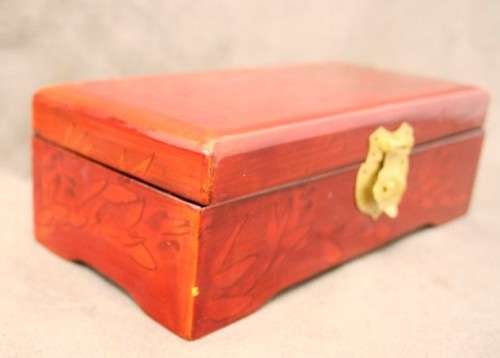 A beautifully made wooden Chinese jewellery box with brass latch and hinges.