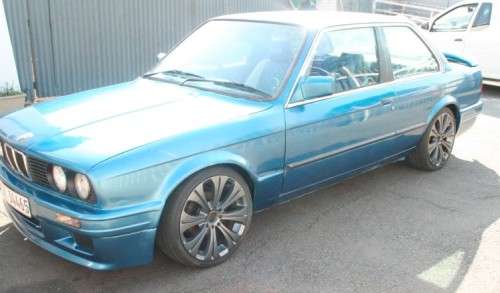 A highly collectible 1989 BMW (E30) converted to 325IS Coupe in metallic blue 90% restored.