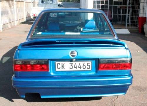 A highly collectible 1989 BMW (E30) converted to 325IS Coupe in metallic blue 90% restored.