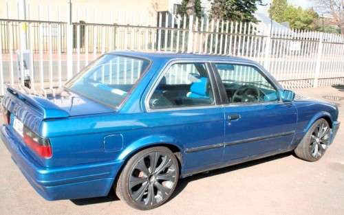 A highly collectible 1989 BMW (E30) converted to 325IS Coupe in metallic blue 90% restored.