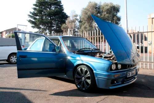 A highly collectible 1989 BMW (E30) converted to 325IS Coupe in metallic blue 90% restored.