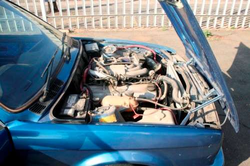 A highly collectible 1989 BMW (E30) converted to 325IS Coupe in metallic blue 90% restored.
