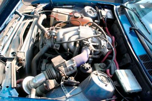A highly collectible 1989 BMW (E30) converted to 325IS Coupe in metallic blue 90% restored.