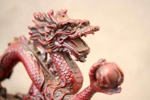 A fabulous red resin Oriental dragon figurine. Stunning on display