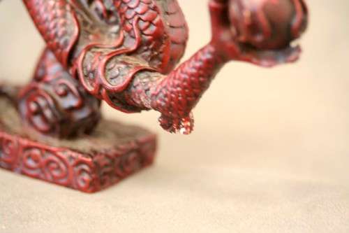 A fabulous red resin Oriental dragon figurine. Stunning on display