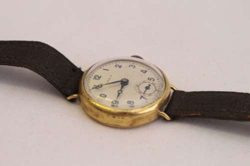 A very pretty & rare round-faced Viola gold filled mechanical ladies wrist watch w/ a leather strap