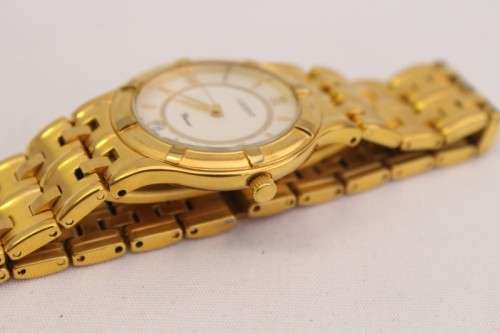 A fantastic 23k gold plated white-dial Lucent Diacoat quarts gents dress watch with spare links