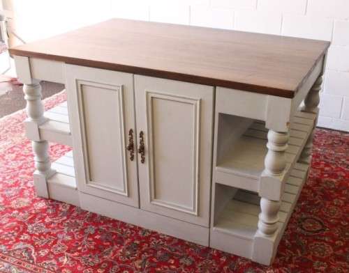 A stunning larger kitchen centre island with two large pot drawers, double-door cupboard & shelves