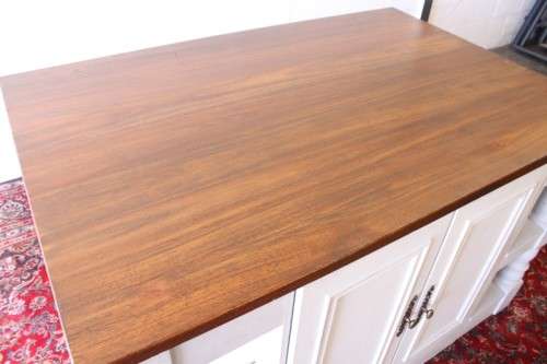 A stunning larger kitchen centre island with two large pot drawers, double-door cupboard & shelves