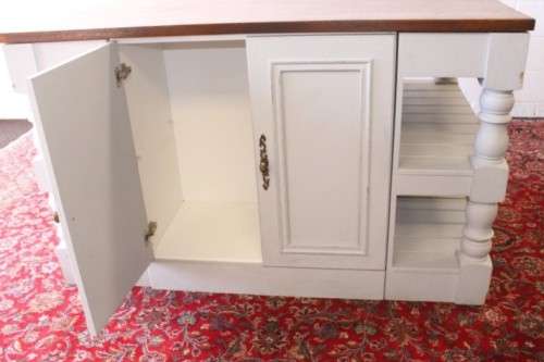 A stunning larger kitchen centre island with two large pot drawers, double-door cupboard & shelves