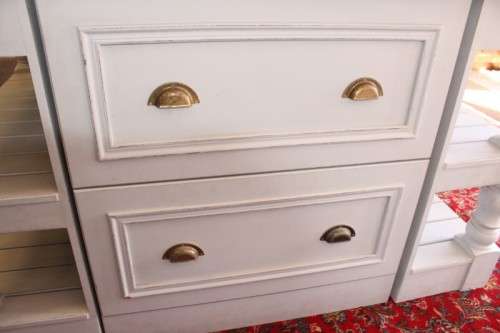 A stunning larger kitchen centre island with two large pot drawers, double-door cupboard & shelves