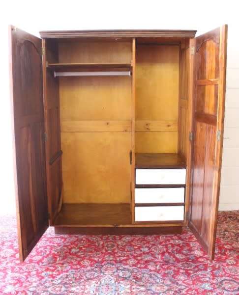 An awesome vintage solid Imbuia 2-door wardrobe with ample hanging space and packing space