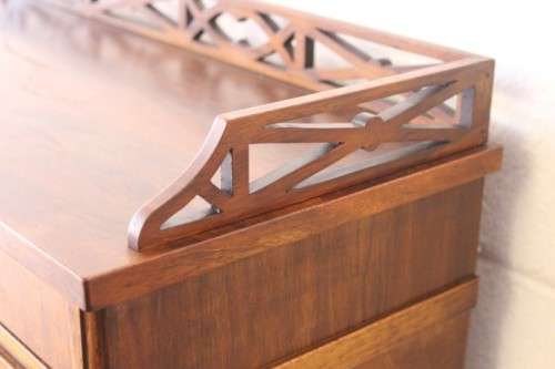 A magnificently made walnut barrel-roll top writing desk with an array of drawers and pigeon holes
