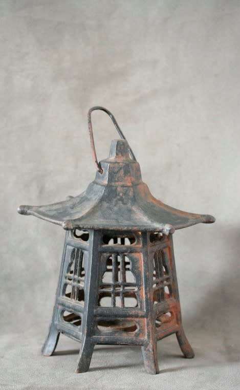 An amazing vintage Chinese cast iron candle lantern with lovely detailing.