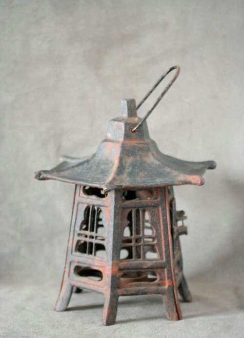 An amazing vintage Chinese cast iron candle lantern with lovely detailing.
