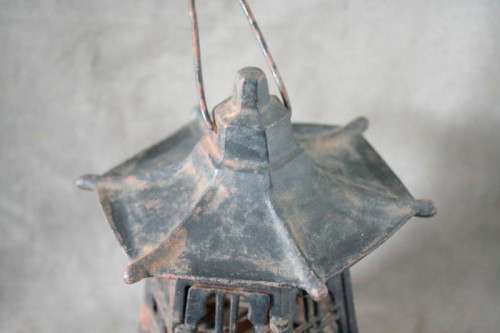 An amazing vintage Chinese cast iron candle lantern with lovely detailing.