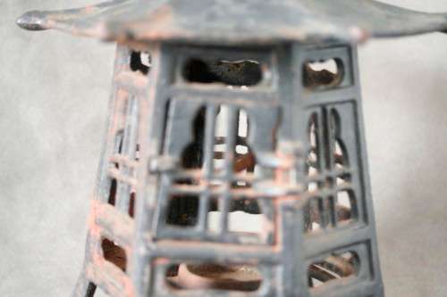 An amazing vintage Chinese cast iron candle lantern with lovely detailing.