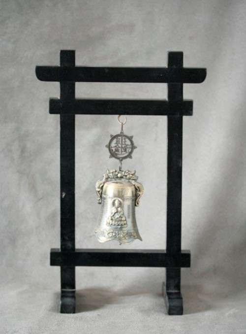 An amazing vintage Chinese bell on a wood stand with lovely detailing.