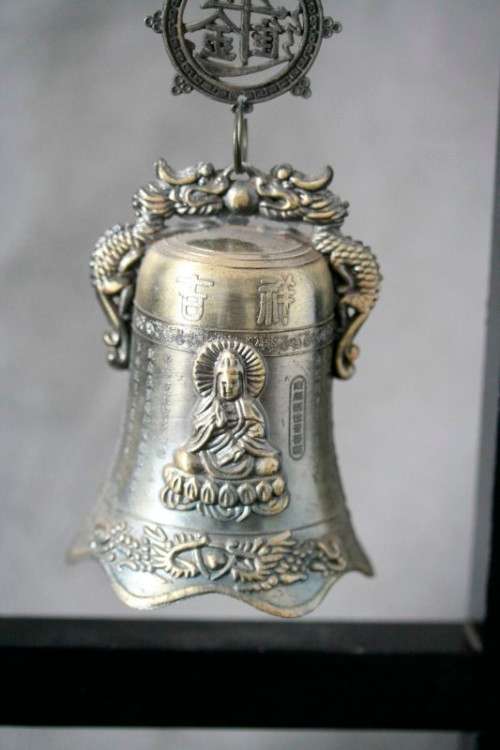 An amazing vintage Chinese bell on a wood stand with lovely detailing.