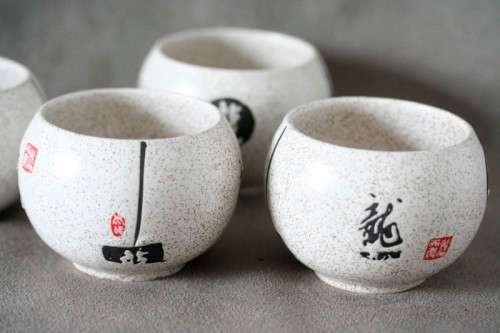 A lovely set of four decorative Chinese ceramic tea cups.
