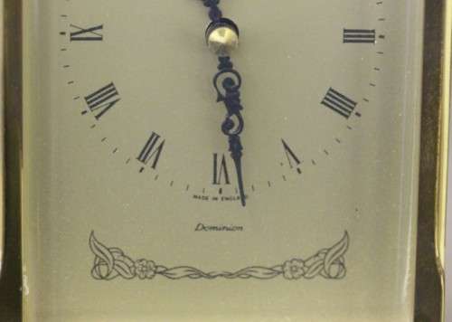 A beautiful vintage "Dominion" brass and marble battery operated carriage clock, working.