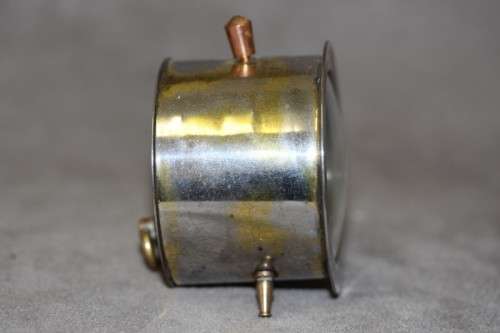 A gorgeous vintage mini round silver metal wind up clock, working.