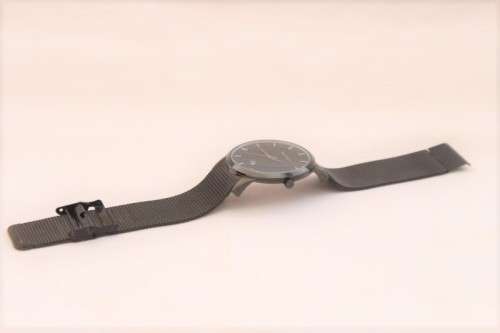 A stylish black Buren all stainless steel men's watch with an adjustable black mesh strap