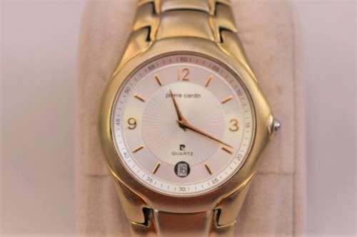 A wonderful vintage white-face Pierre Cardin gold plated gents quartz wrist watch with a date window