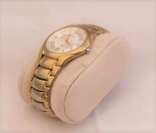 A wonderful vintage white-face Pierre Cardin gold plated gents quartz wrist watch with a date window