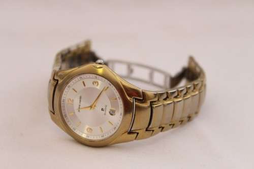 A wonderful vintage white-face Pierre Cardin gold plated gents quartz wrist watch with a date window