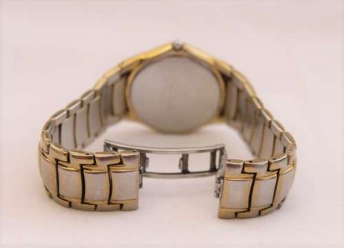A wonderful vintage white-face Pierre Cardin gold plated gents quartz wrist watch with a date window