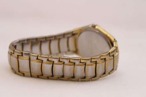 A wonderful vintage white-face Pierre Cardin gold plated gents quartz wrist watch with a date window
