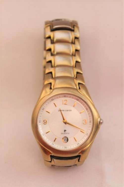 A wonderful vintage white-face Pierre Cardin gold plated gents quartz wrist watch with a date window