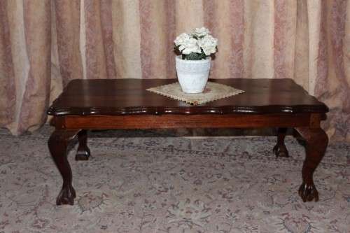 A lovely vintage scalloped edge solid Imbuia wood ball and claw coffee/ side table