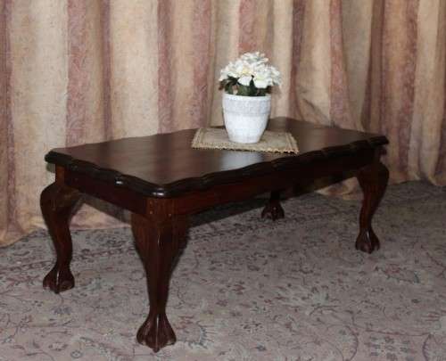 A lovely vintage scalloped edge solid Imbuia wood ball and claw coffee/ side table