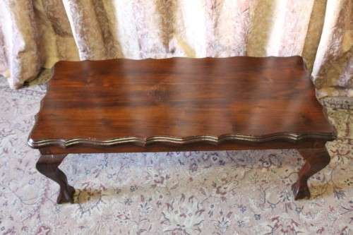 A lovely vintage scalloped edge solid Imbuia wood ball and claw coffee/ side table