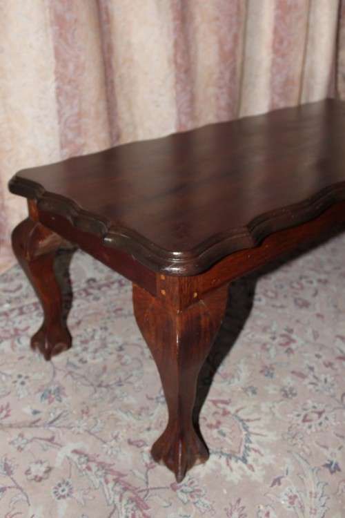A lovely vintage scalloped edge solid Imbuia wood ball and claw coffee/ side table