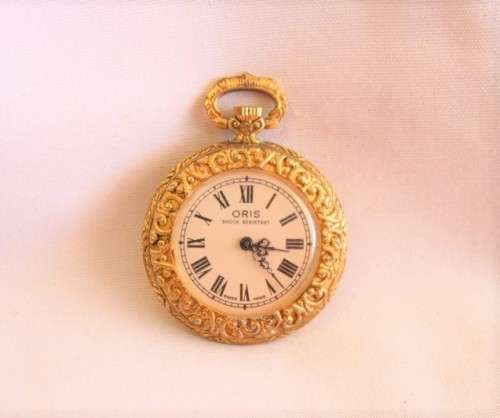 A stunning ornate vintage gold plated 7-Jewel Swiss made Oris ladies pocket watch