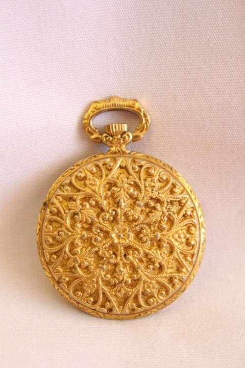 A stunning ornate vintage gold plated 7-Jewel Swiss made Oris ladies pocket watch
