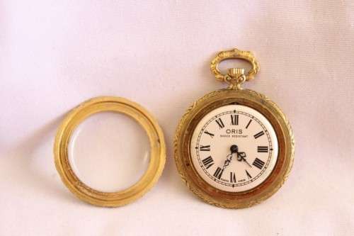 A stunning ornate vintage gold plated 7-Jewel Swiss made Oris ladies pocket watch