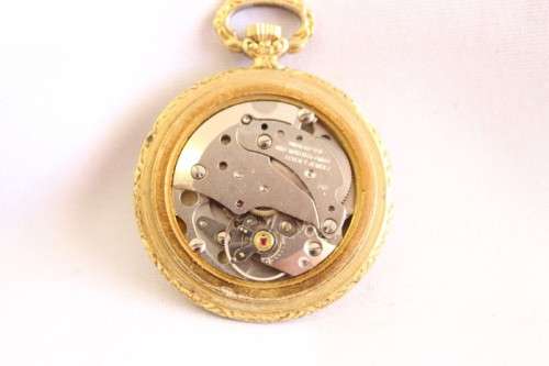 A stunning ornate vintage gold plated 7-Jewel Swiss made Oris ladies pocket watch