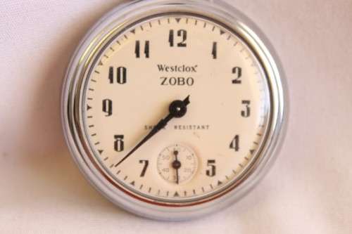 A gorgeous antique Canadian made Westclox Zobo chrome plated open-face pocket watch with a fob chain