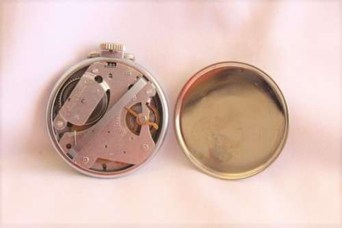 A gorgeous antique Canadian made Westclox Zobo chrome plated open-face pocket watch with a fob chain